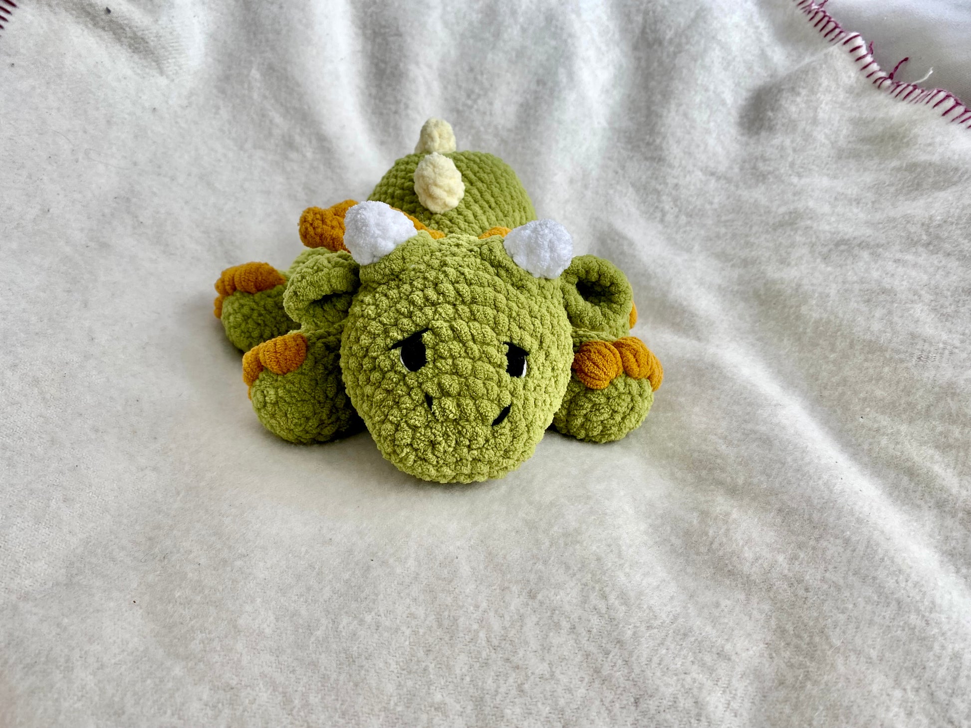 Amigurumi dragon in spring colors