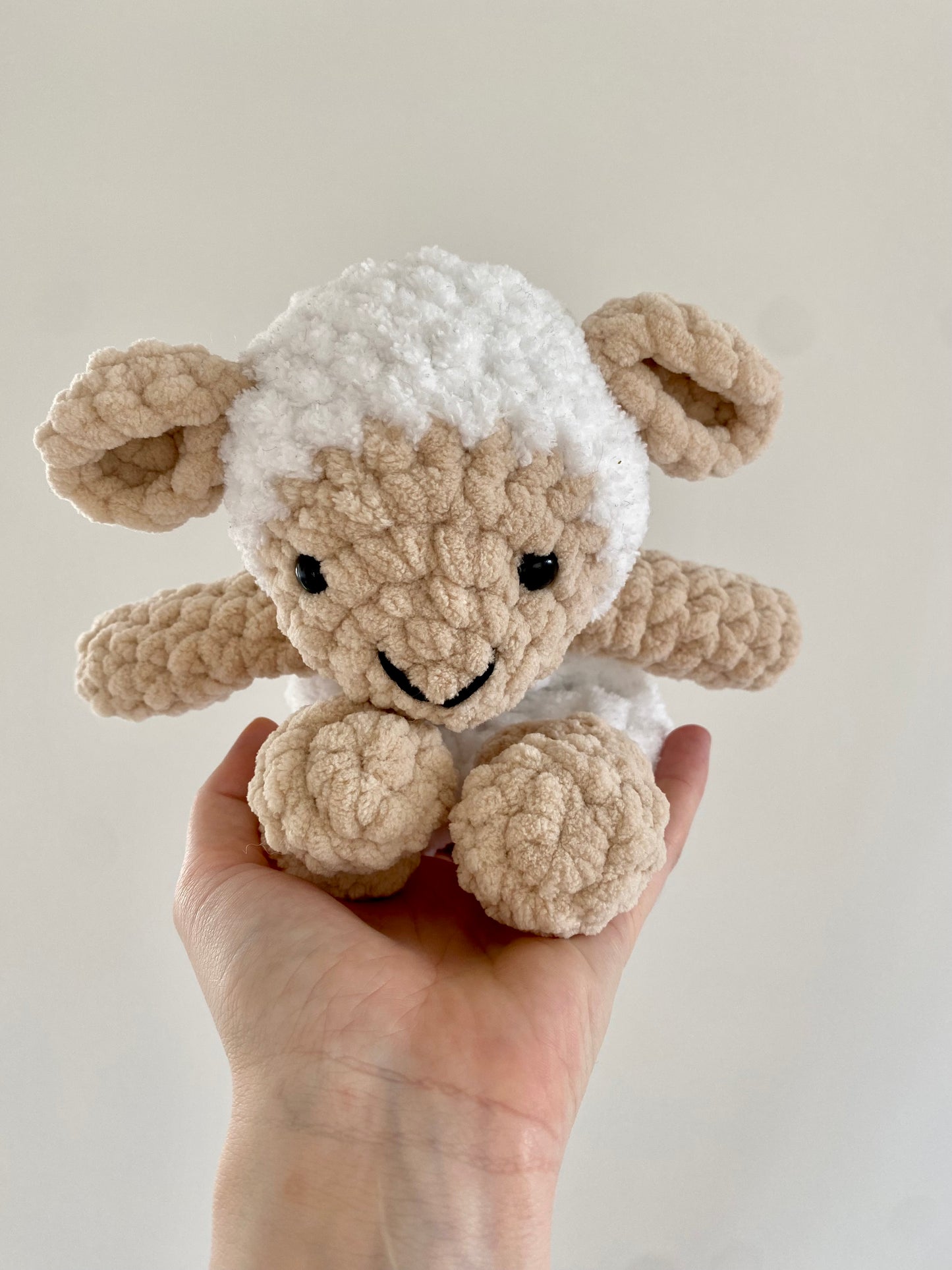 A detailed look at the lovey’s knotted corners and textured body, emphasizing the easy-to-follow crochet techniques for creating a durable and comforting plushie.